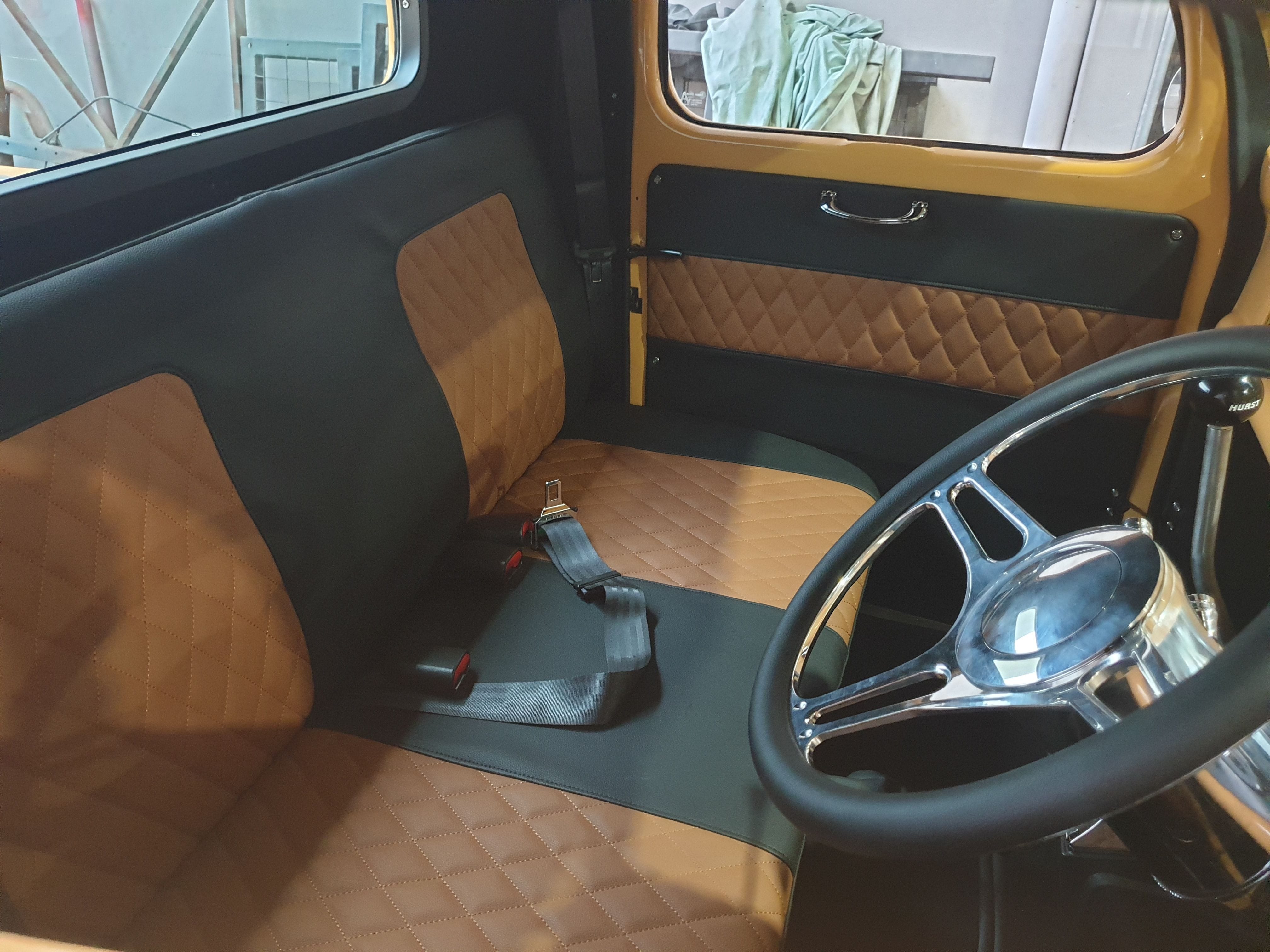 diamond pleats and simple borders is very effictive in this 1930's pickup. The bench seat was custom made to maximise cabin space.