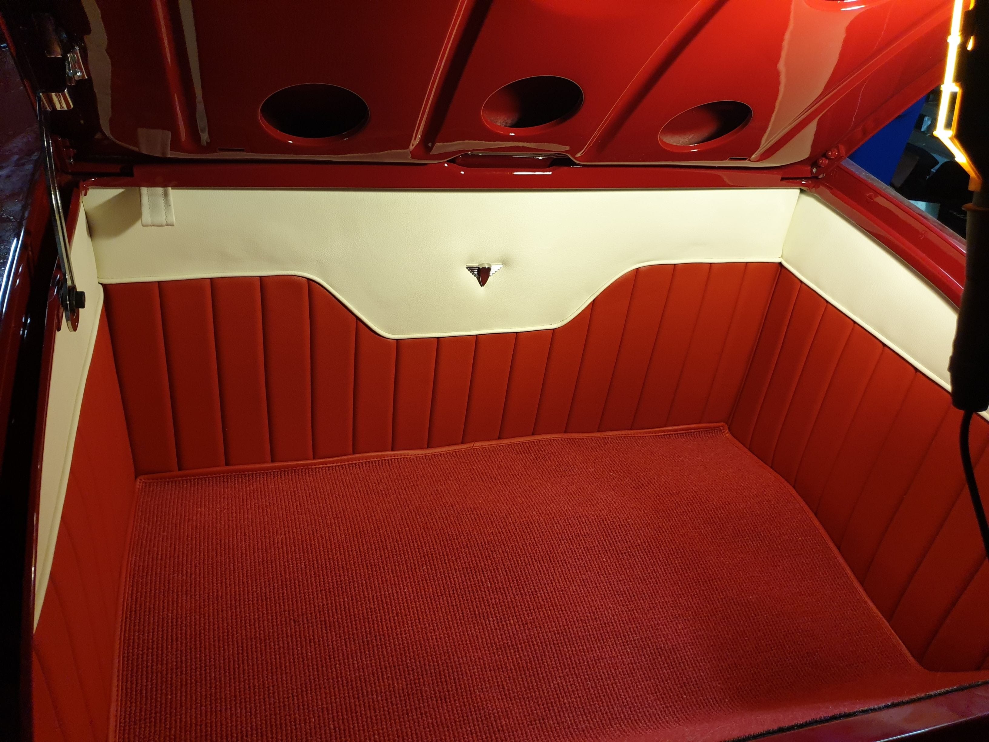 Traditional tuck n roll interior in a 1928 Ford Roadster trunk